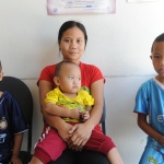 A mother and three children at a healthcare provider