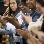 Women of color applauding