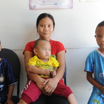 A mother and three children at a healthcare provider